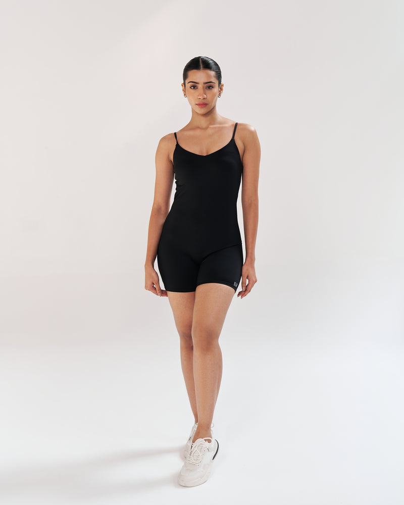 Sleek and sultry in black playsuit, designed for the modern woman. Seamless, soft neckline, and a built-in shelf bra provide full support. Adjustable spaghetti straps offer a customizable fit. Quick Drying, 4 Way Stretch, Lightweight & Breathable