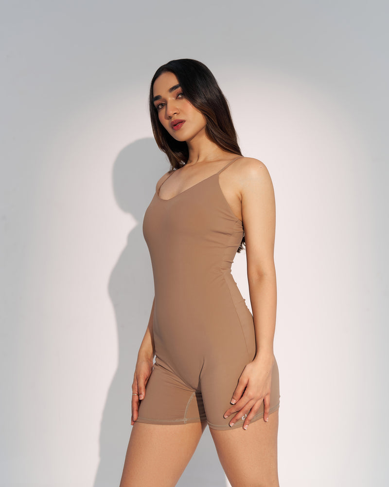 Effortless elegance in our nude beige playsuit. Body-hugging fit, no front seam, soft neckline, and adjustable spaghetti straps for a flawless look. Full support with a built-in shelf bra. Quick Drying, 4 Way Stretch, Lightweight & Breathable