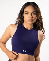 female model wearing purple blue high neck sports bra made for gym and workout