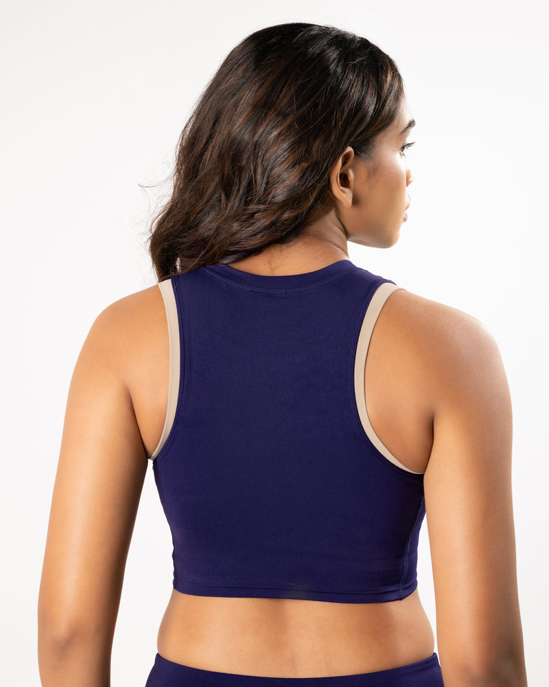 Female model showing the back of purple blue high neck sports bra