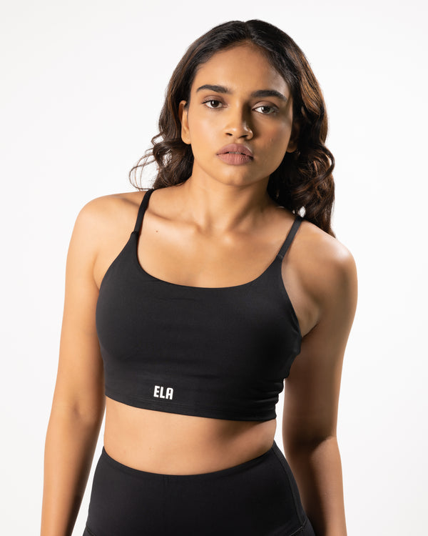 female model wearing black sports bra suitable for gym, yoga or any workout