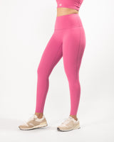 model posing in pink leggings for workout with a high waist and full-length fit, perfect for any athletic activity