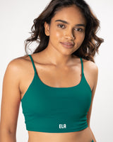 Female Model in a Teal green sports bra with straps suitable for all kinds of workout activities