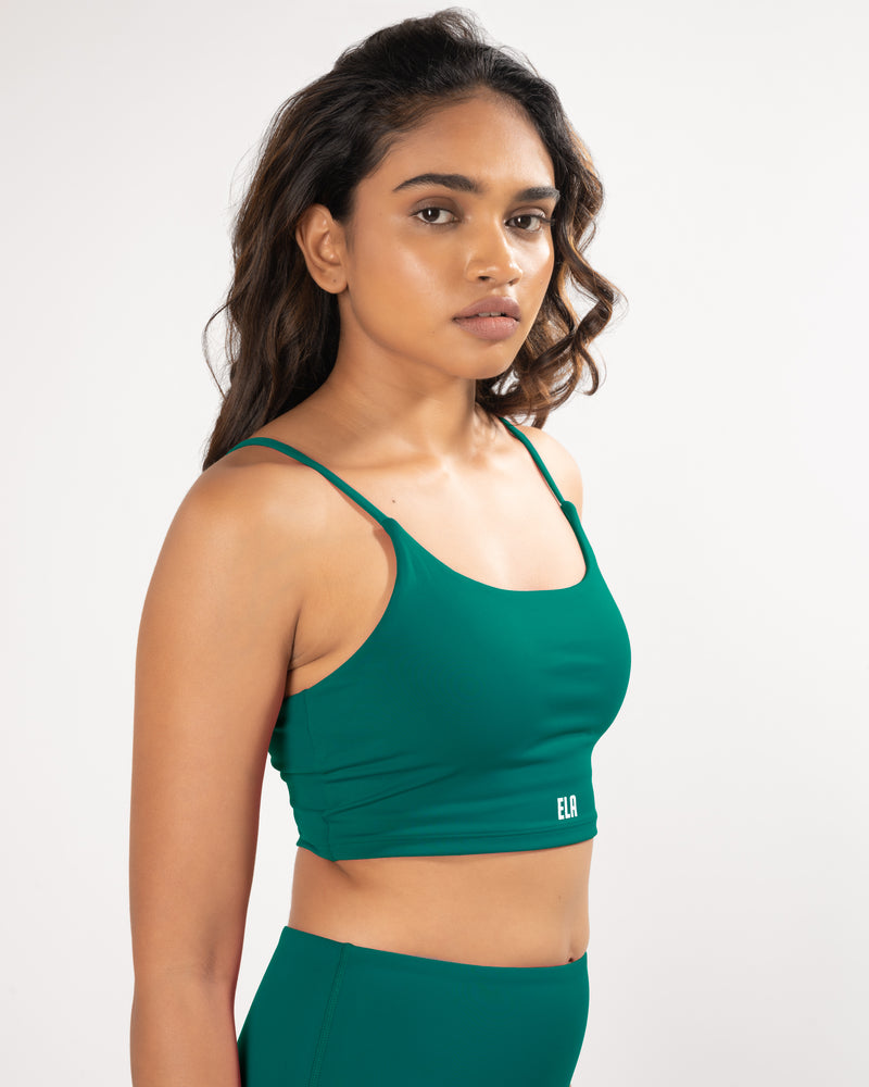 Female Model in a Teal green sports bra with straps suitable for all kinds of workout activities
