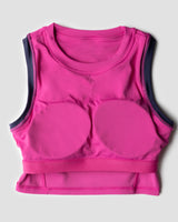 Flatlay image of fuschia high neck sports bra showing internal structure of in-built pads for maximum support during workout 